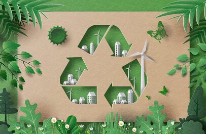 Recyle-pictogram omringd door gebouwen, groen en windmolens